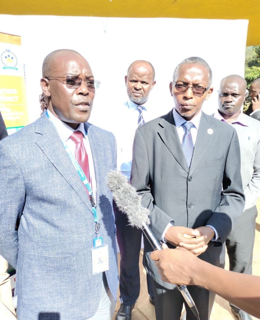 Cooperative University VC Prof Ngamau (left) receive the server manual. Image. BDA