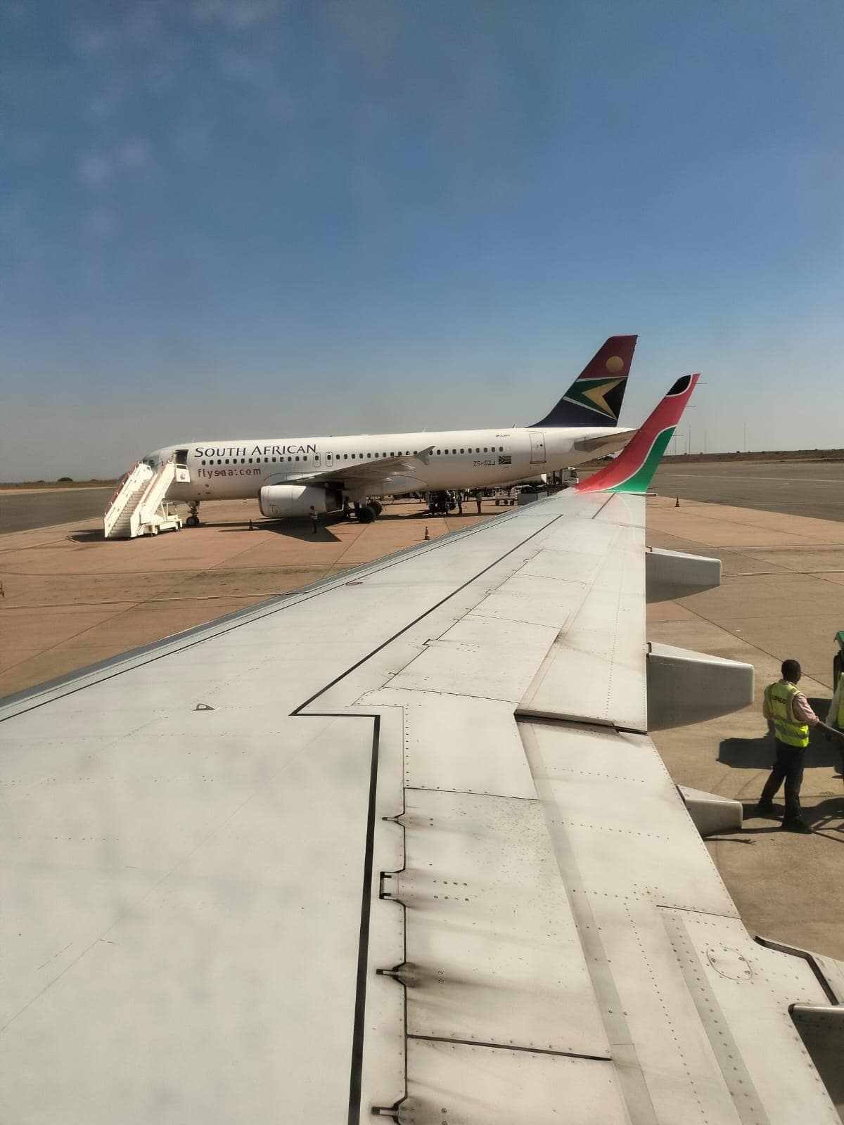 A Kenya Airways aircraft and a SAA at the Kamuzu Banda Airport in Lilongwe. Image: Gerald Andae